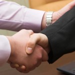 two businessman shaking hands two businessman shaking hands